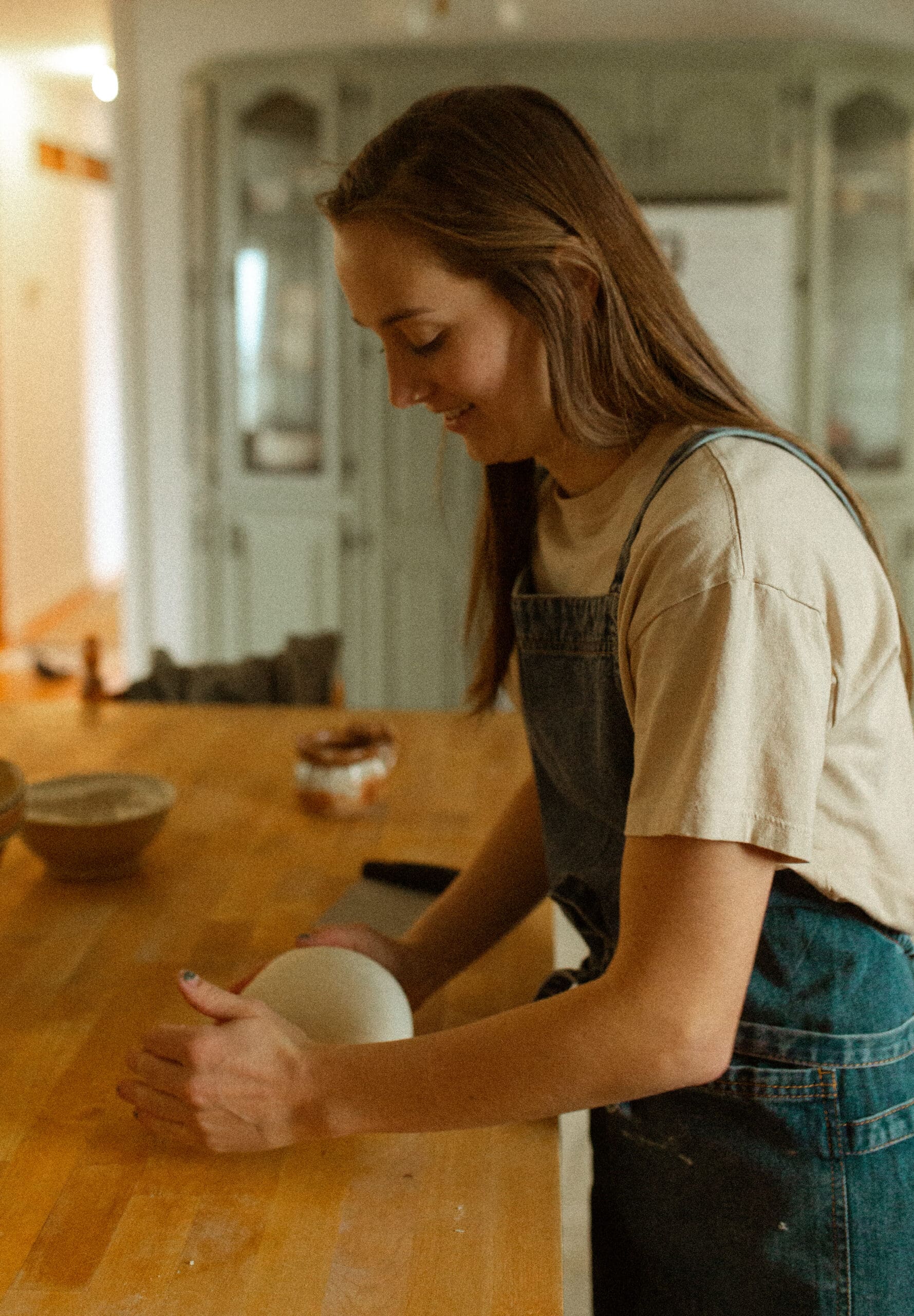 shaping a loaf of sourdough bread