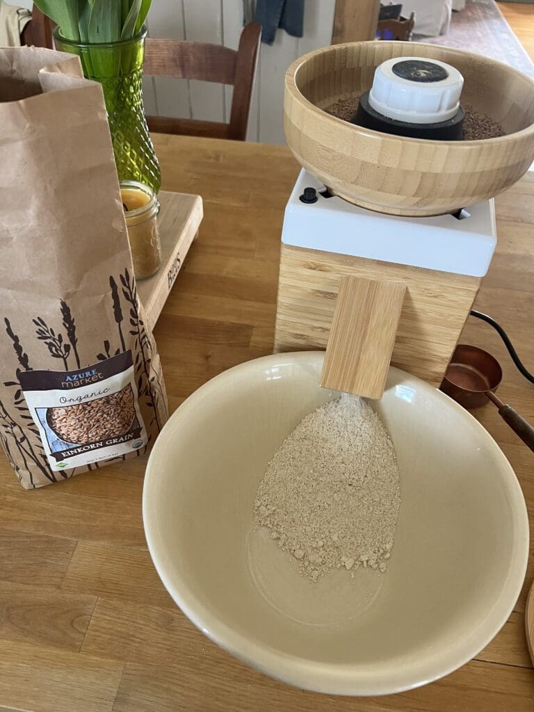 Grain Mill with a bag of einkorn flour sitting on the counter. 